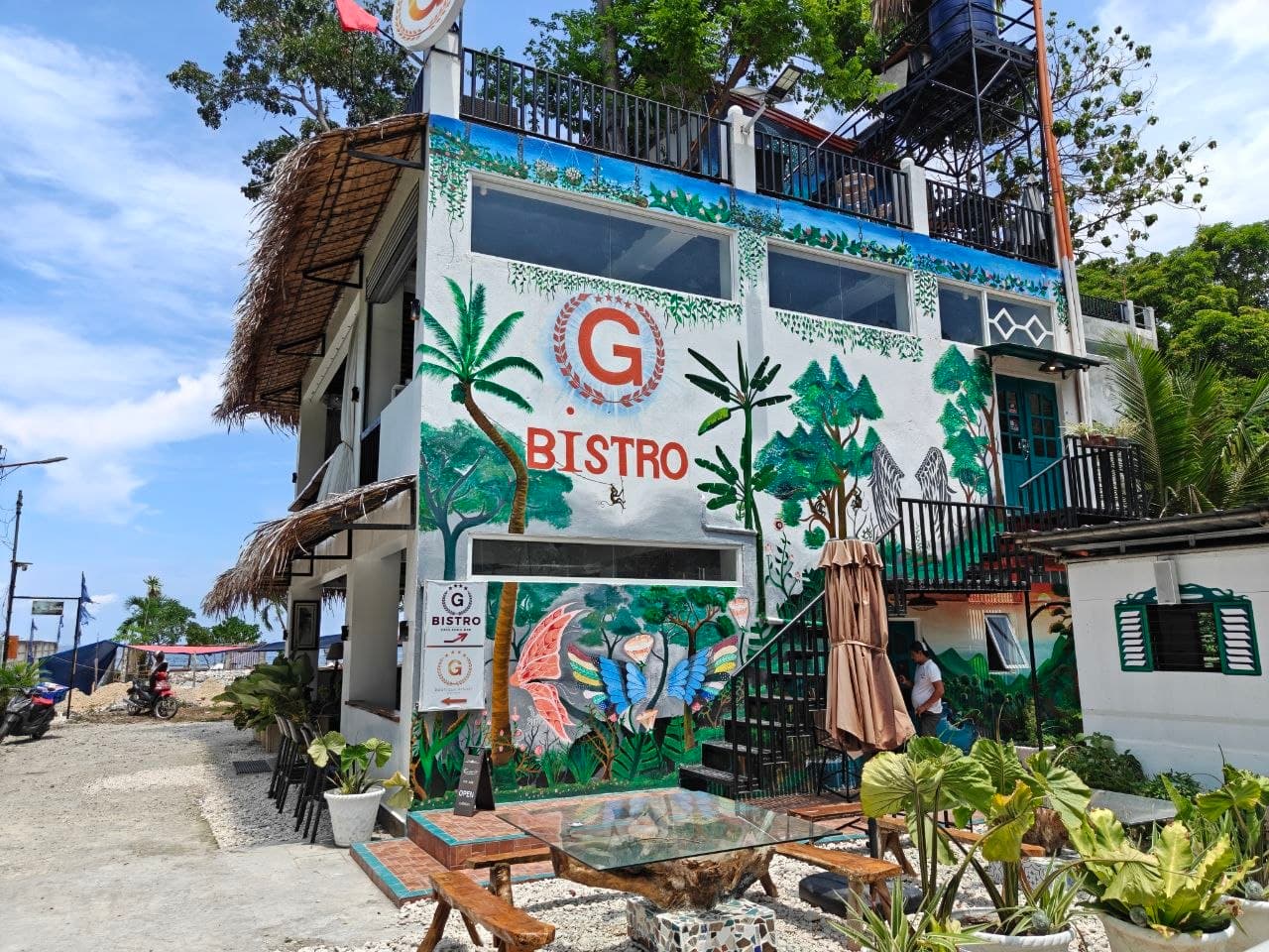 The G Bistro mural exterior at G Boutique Resort in Santander, Cebu