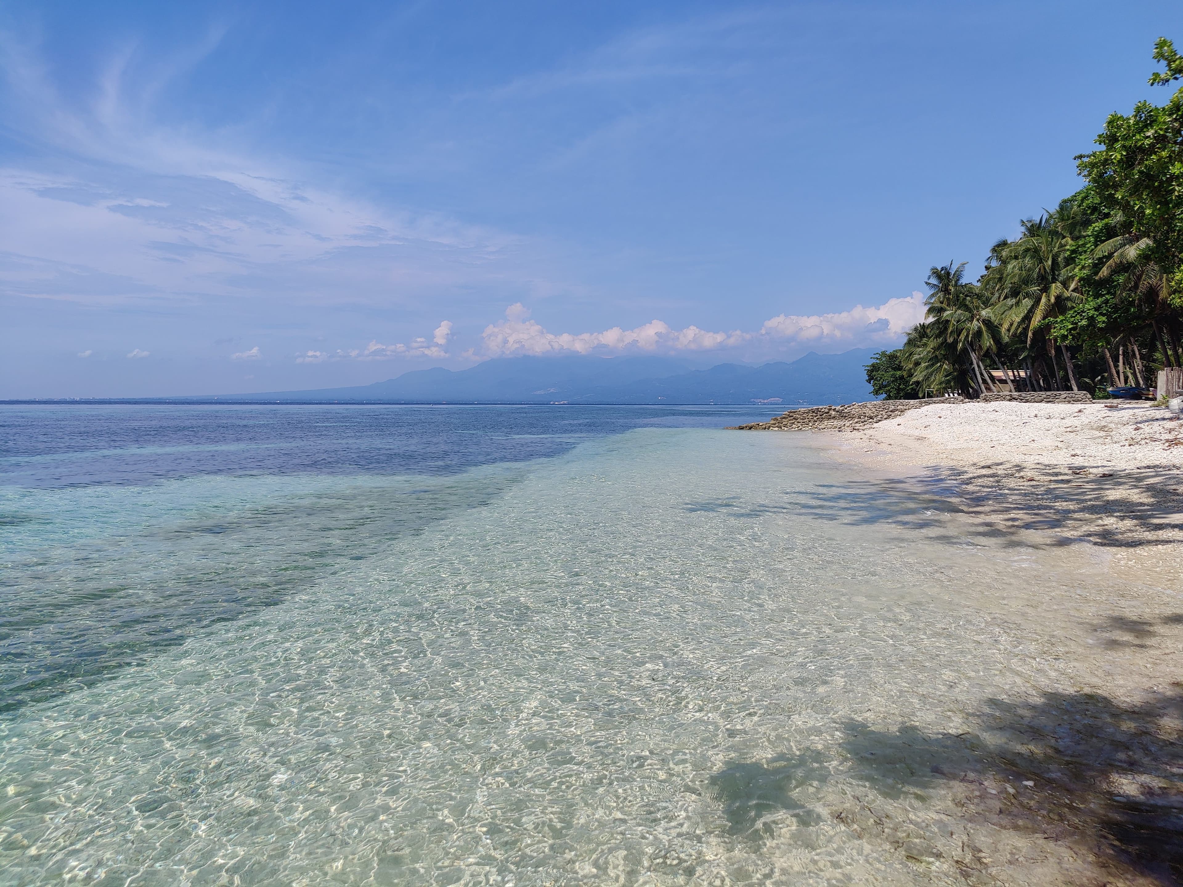 Clear shallows, Negros across the strait