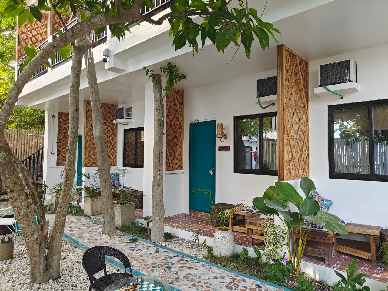 Teal doors along the cabana walk