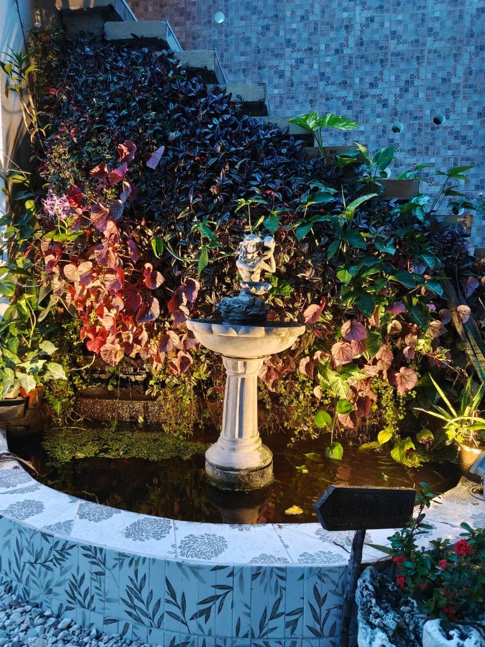 The leafy fountain garden at G Boutique Resort
