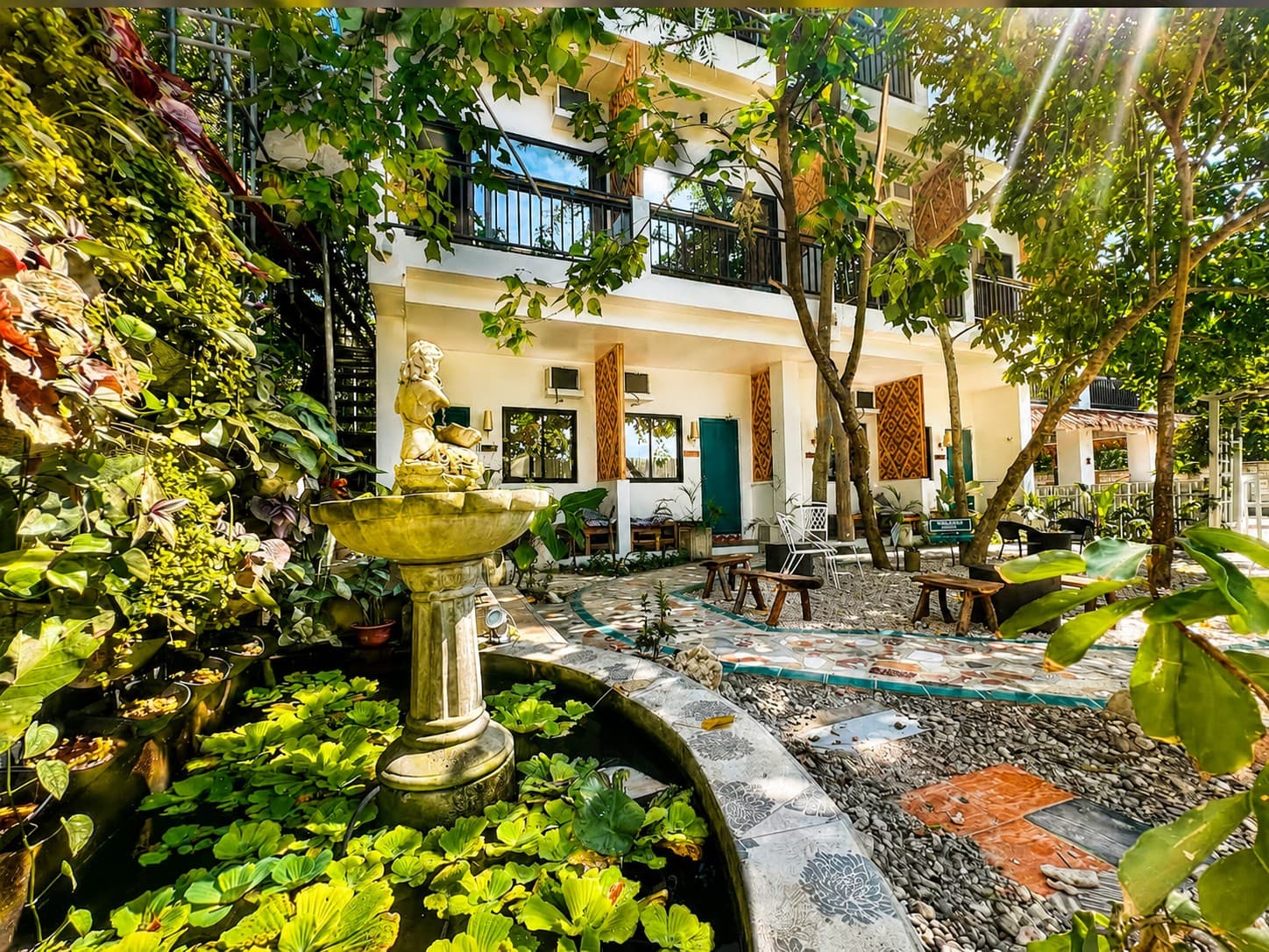 The tropical fountain courtyard at G Boutique Resort